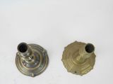 pair of antique brass candlesticks on a white background