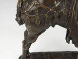 bronze statue of a man on a horse with a sword