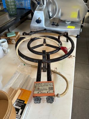 a picture of a kitchen counter with a stove top and a blender