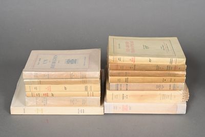 several books stacked on top of each other on a table