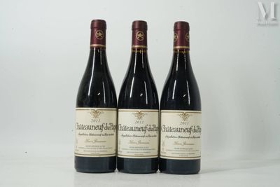 three bottles of wine sitting on top of a table next to each other