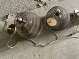 two lamps that are sitting on the ground next to each other