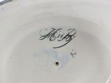 a close up of a white plate with writing on it