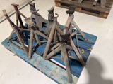 a pile of old tools on a pallet on the floor