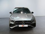 the front of a silver mercedes cla parked in a showroom