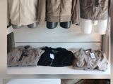 a picture of a display of clothing on a shelf