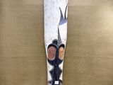 an image of a wooden stick with a bird on it