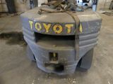 an image of a toyota forklift in a garage