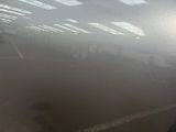 someone is standing in a foggy room with their feet on the floor