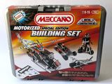 meccan motorized building set in metal case on white surface