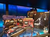 many star wars action figures on display in a store