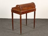 an old wooden desk with a drawer on top of it