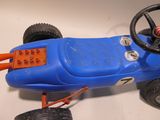 a blue toy car with a steering and a steering wheel