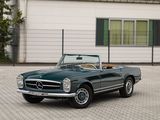 a green convertible car parked in front of a building