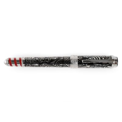 a close up of a fountain pen with a black and white design
