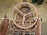 an old rusted out fire hydrant with a steering wheel