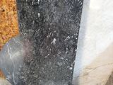 a black and white marble slab on the floor