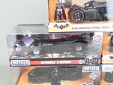 many batman toys on display in a display case