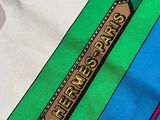 a colorful tie with a wooden sign on it