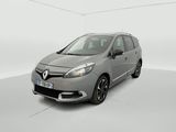 a grey car is parked in a white room with a white floor