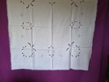 a white table cloth with a design on it