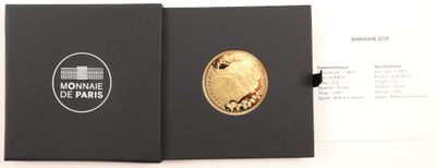 a close up of a black box with a gold coin in it