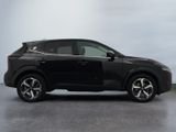 the black suv is parked in a room with a gray floor