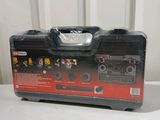 an open tool box sitting on top of a table next to a wall