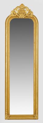 a gold framed mirror on the wall next to a white wall