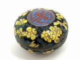 a black and yellow box with yellow flowers on it