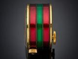 an image of a red and green ring on a black surface