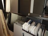a file cabinet with a bunch of folders in it