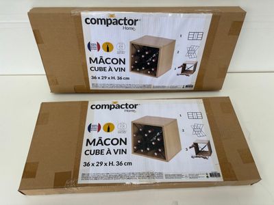 two boxes of compactor macon cubes are sitting on a table