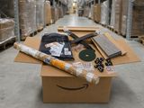 a box full of items sitting on top of a floor in a warehouse