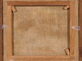 an old picture frame with a piece of wood on top of it