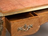 a wooden desk with a drawer on top of it