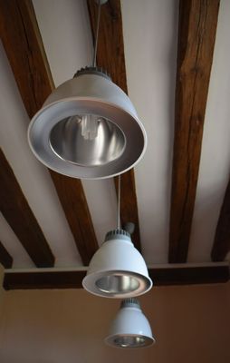 two lamps hanging from the ceiling in a room