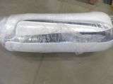 a large white object wrapped in plastic on the floor