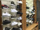 a lot of shoes that are on display in a store