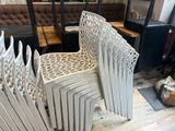 a lot of chairs that are sitting on a wooden floor