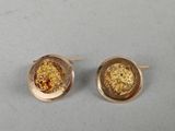 gold plated stud earrings with a golden flower in the center