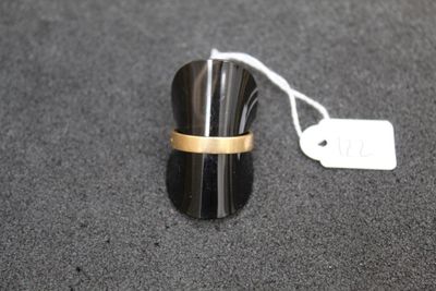 a ring with a gold band on it on a table