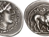 a close up of a coin with a horse on it