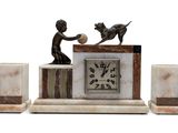 a statue of a boy and a dog playing with a ball