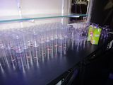 a lot of empty glasses sitting on a table