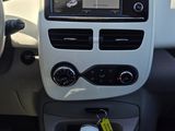 the interior of a car with a steering wheel and dashboard controls