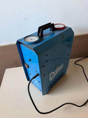 a blue machine that is sitting on a table