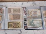 a lot of old paper money sitting on a table