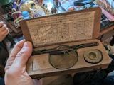 a person holding a box that has a pair of glasses in it
