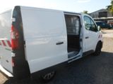 a white van with its doors open in a parking lot